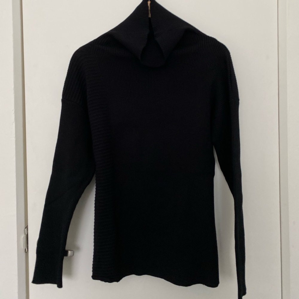 Never worn, asymmetrical stitched sweater